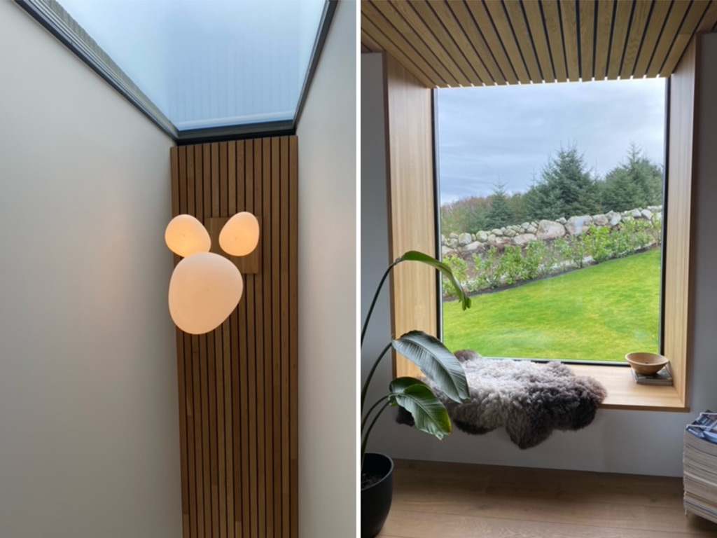 Bilde av to vinduer med elementer av spiler i både tak og langs veggen. Moderne lampe i taket. Finalist nummer 3 i interiørprisen 2021.